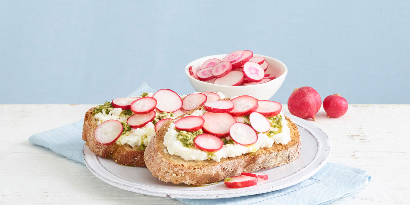 Lemon ricotta and pesto open sandwich with quick-pickled radishes