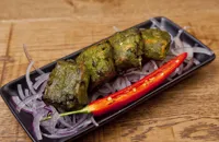 Tandoor-grilled Alaska salmon with lime-leaf and spinach marinade