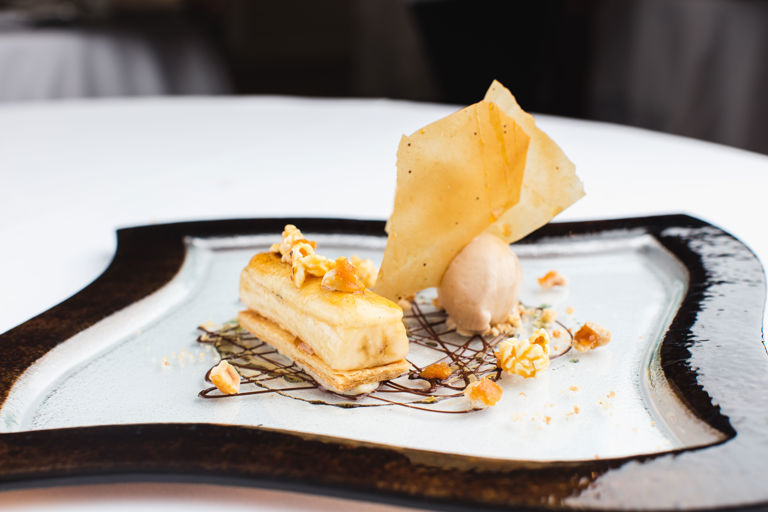Caramelised banana mille-feuille with praline ice cream and toffee popcorn