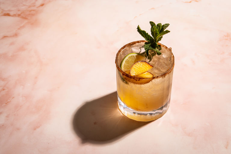 Five-spice bourbon spritz with peaches and mint