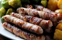 Chipolatas wrapped in streaky bacon