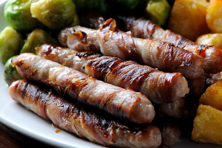 Chipolatas wrapped in streaky bacon