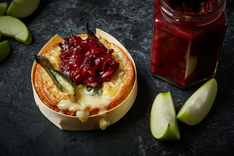 Baked camembert with sage, apple wedges and cranberry and bacon jam