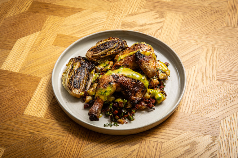 Spatchcock poussin with chorizo potatoes, braised gem lettuce and mustard dressing