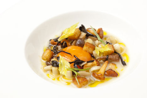 Chicken soup with glazed wild mushrooms and confit egg yolk