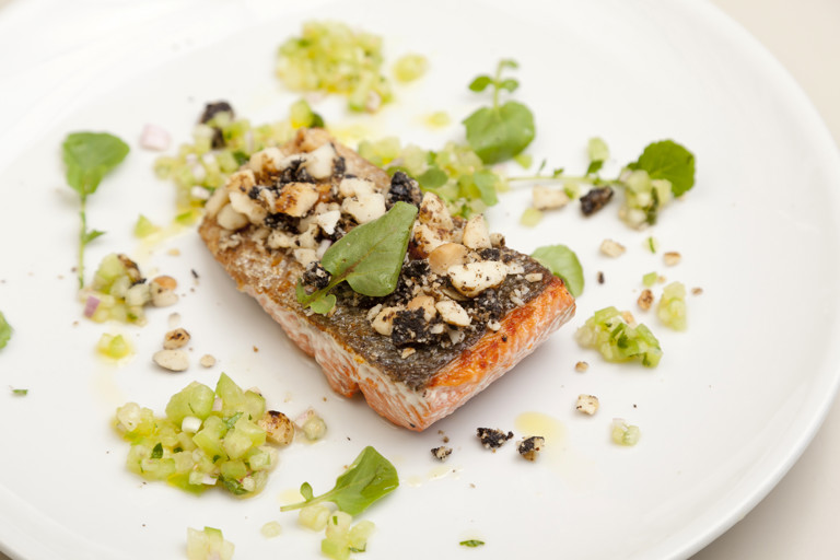 Black garlic, liquorice and macadamia crusted Alaska salmon with tomatillo salsa