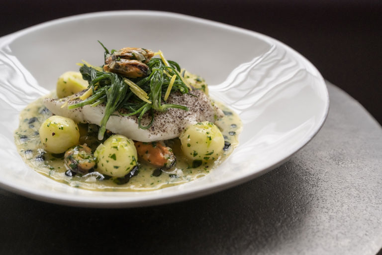 Steamed brill with mussels, Jersey Royals, monk's beard and preserved lemon