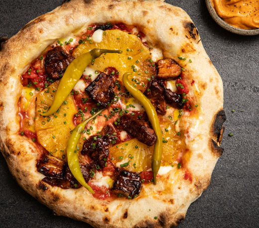 Sourdough pizza with pork belly, pineapple and gochujang butter