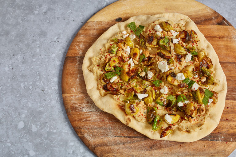 Baba ganoush and Brussels sprouts flatbread with feta, hazelnuts and mint