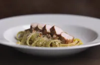 Loin of rabbit with fettuccine, prosciutto and roasted hazelnuts 