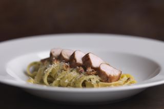 Loin of rabbit with fettuccine, prosciutto and roasted hazelnuts