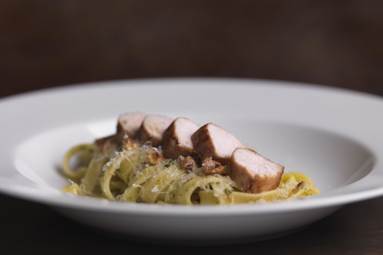 Loin of rabbit with fettuccine, prosciutto and roasted hazelnuts 