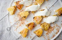 Pineapple kebabs with lime crème fraîche and toasted coconut