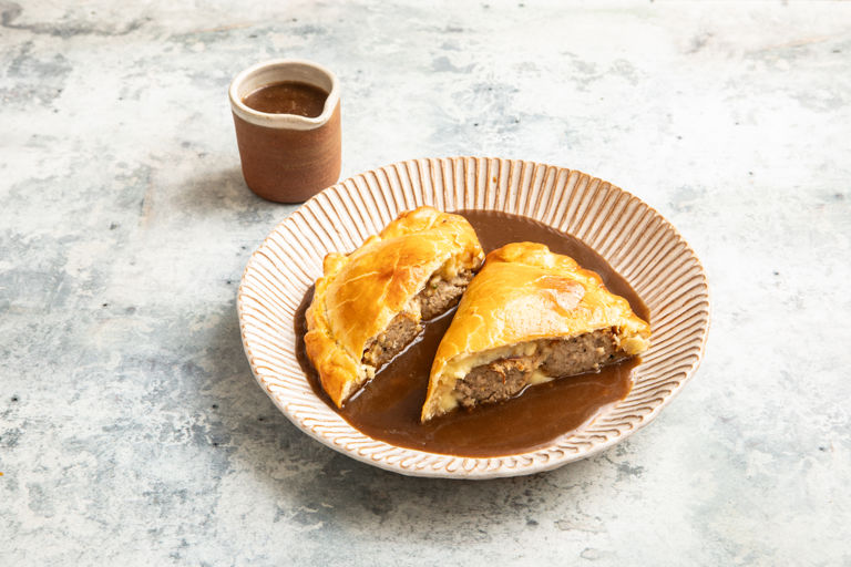 Bangers and mash pasty with lager and caramelised onion gravy