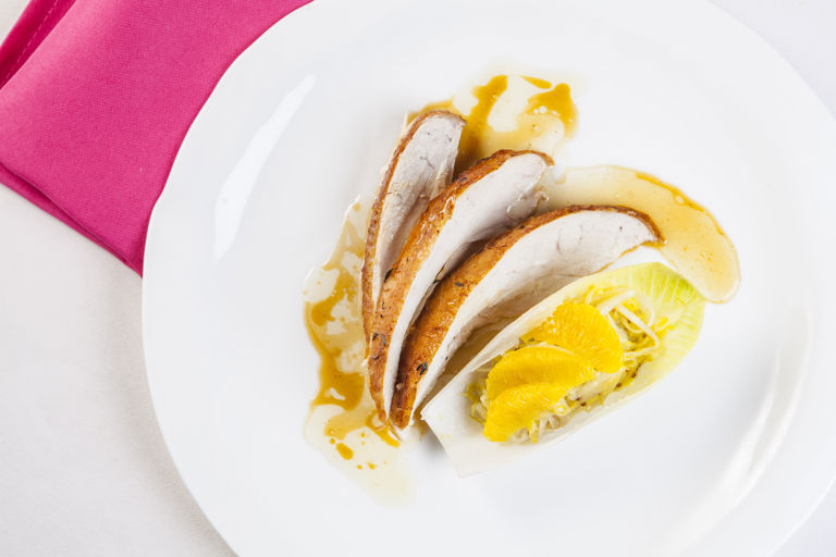 Lemon-baked chicken with chicory salad and citrus dressing