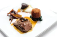 Pork cooked three ways with cauliflower purée, Swiss chard and Ravigôte sauce