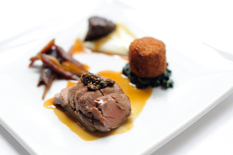 Pork cooked three ways with cauliflower purée, Swiss chard and Ravigôte sauce
