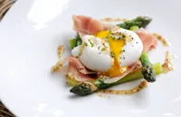 Poached duck egg with English asparagus, cured ham and grain mustard dressing