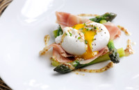 Poached duck egg with English asparagus, cured ham and grain mustard dressing