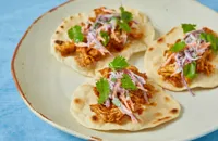 Spicy pulled chicken and slaw mini tacos