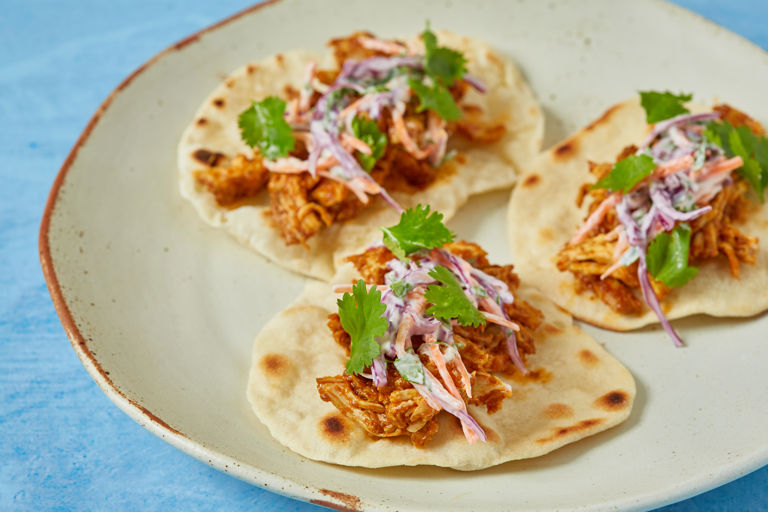 Spicy pulled chicken and slaw mini tacos
