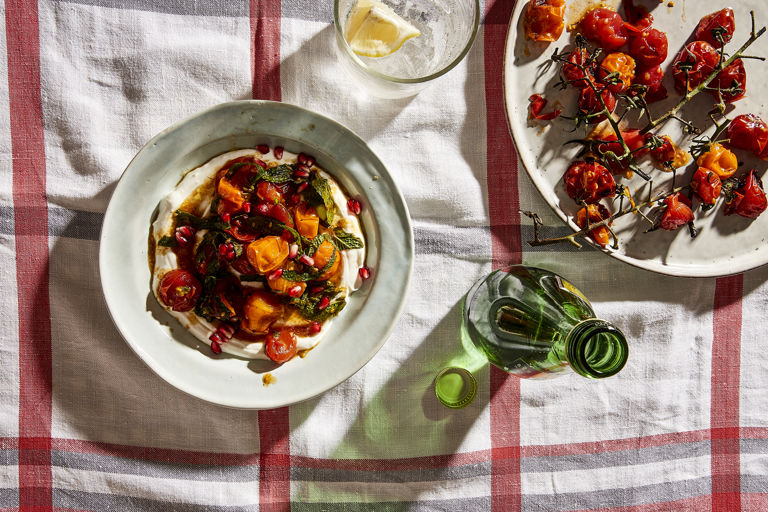 Charred tomatoes with cool yoghurt, pomegranate molasses and herbs