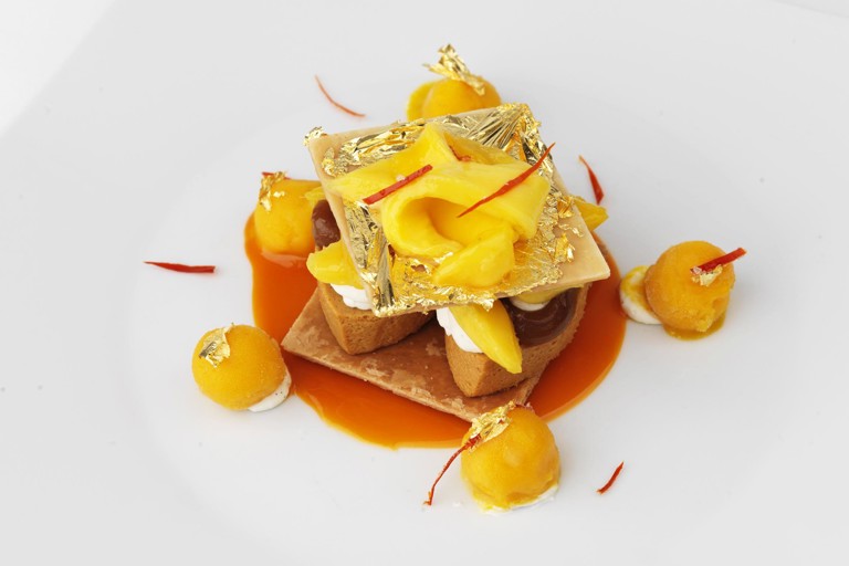 Caramel mille feuille, mango and gold leaf press and crystalised chilli