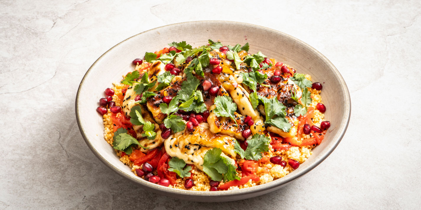 Sticky mango chutney halloumi with couscous and marinated peppers, plated
