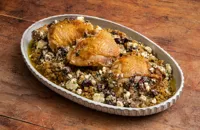Roasted chicken thighs with freekeh and an olive and preserved lemon salsa