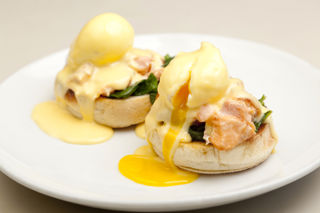 Tea-smoked Alaska salmon, poached eggs, spinach and yuzu hollandaise, English muffin
