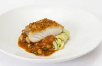 Hake with courgettes, Provençal mussel sauce and crispy breadcrumbs