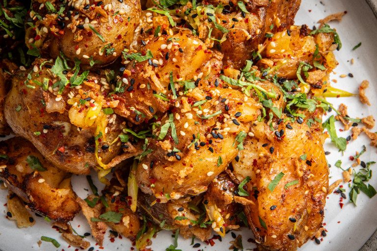 Smashed potatoes with lime and chilli chutney and herby yoghurt dip