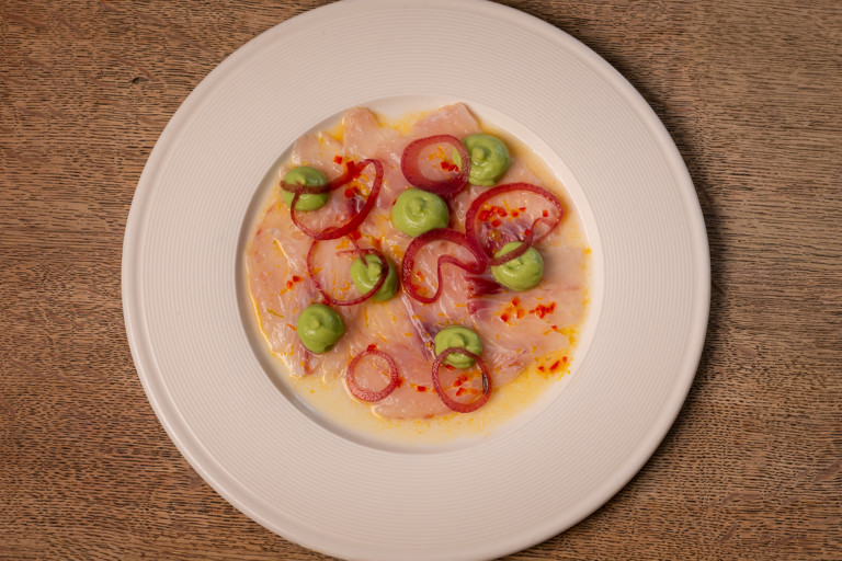Sea bass ceviche with red-wine pickled onion and avocado purée