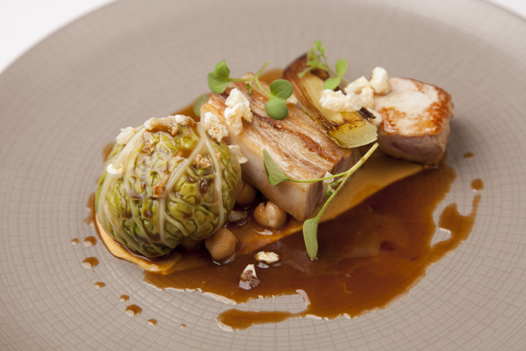 Pork with hummus, chou farci and chickpeas