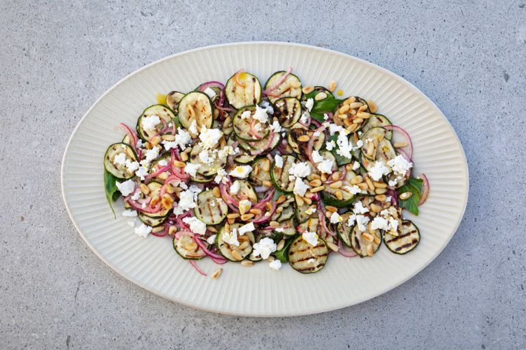 Charred courgettes with red onion, elderflower and feta