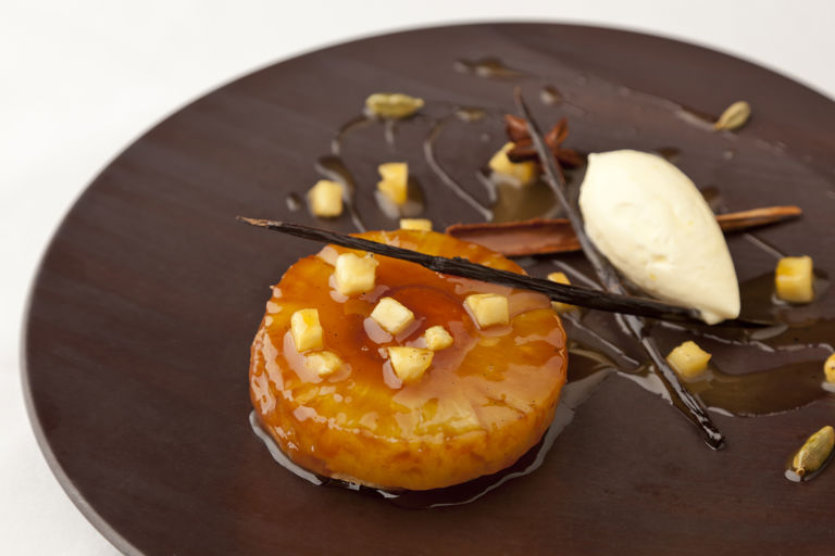 Pineapple upside-down cake, spiced rum caramel, and Devonshire clotted cream