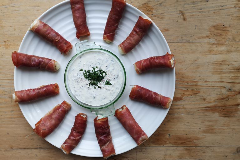 Monkfish fingers with lemon, thyme and pepper, wrapped in Parma ham