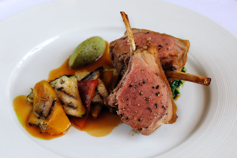Roasted rack of English lamb with chargrilled Provencal vegetables, olive tapenade and basil pesto