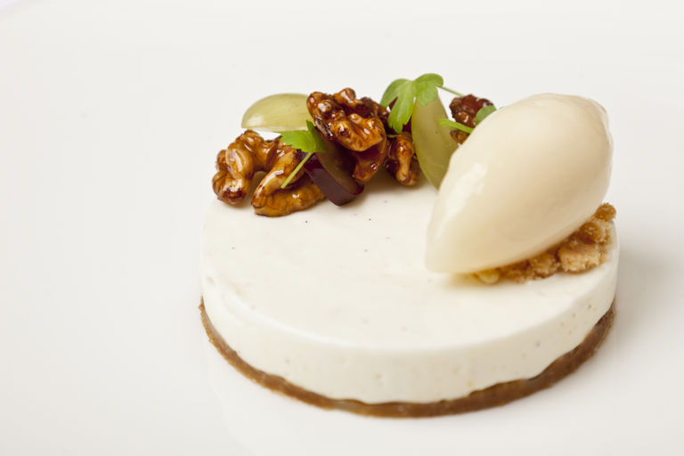 Vanilla cheesecake with candied walnuts, grapes and apple sorbet