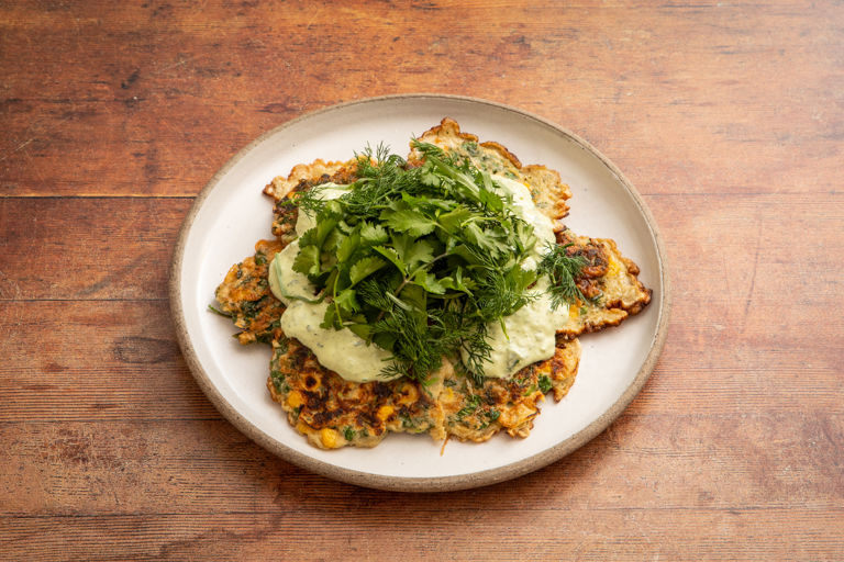 Corn and mixed herb fritters with tahini-yoghurt sauce 