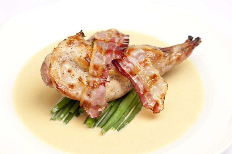 Rabbit with mustard sauce and bacon
