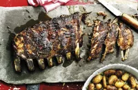 Roasted and grilled pork ribs with quince glaze