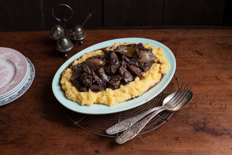 Slow-cooked oxtail stew in red wine on a base of polenta