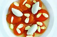 Poached apricots with honey ice cream and fresh almonds