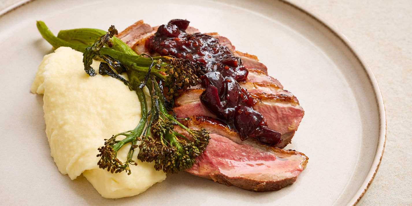 Duck breast with cherry hoisin sauce, pommes purée and charred broccoli