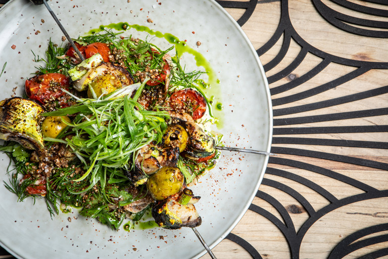 Amba-spiced mackerel skewers, green tarator, fennel and tomato salad