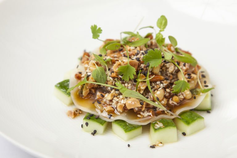 Pulled pork and chorizo ‘raviolo’, pickled cucumber, sesame, peanut and green chilli