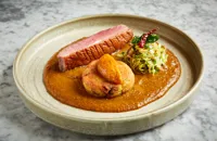 Goose vindaloo with confit leg aloo tiki, sprout and chestnut thoran and apple achaar