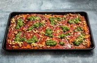 Sicilian style pizza with buttered pine nuts and watercress pesto 