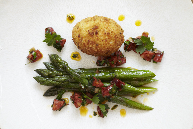 Asparagus with crispy duck egg, chorizo and lovage